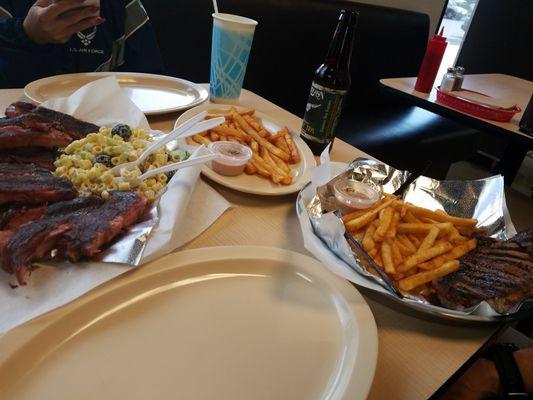 Full rack of ribs, New York strip, homemade  macaroni salad and seasoned fries... smells delish!!!