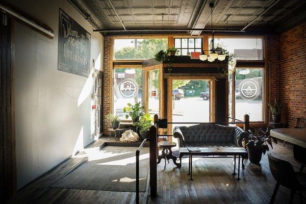 Cozy up on the vintage leather couch by the front