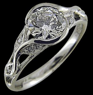 Diamond and platinum engagement ring created by Karina Mattei.