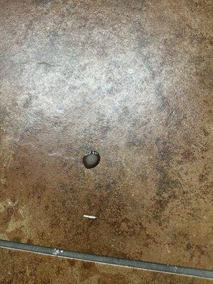 spots of liquid on floors in kitchen and bathroom upon arrival to an uncleaned unit.