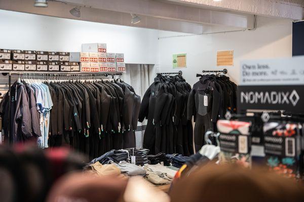 Wetsuits line the walls at Midtown Surf Shop in Carmel-by-the-Sea