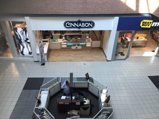 Cinnabon Wolfchase is located between Best Buy and Forever 21. It is also directly across from the Crazy 8 children's store.