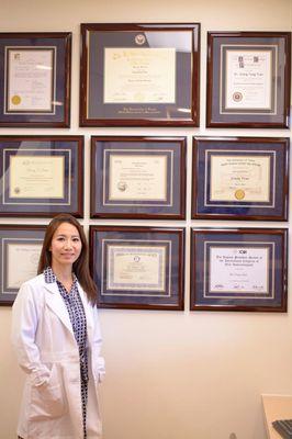 Dr. Tran with her license, degrees and certificates.