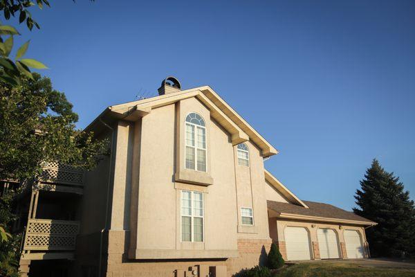 Some apartment homes feature attached or detached garages and arched windows.