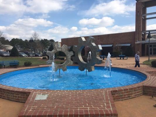 Fountain outside of the Factory with outdoor seating.