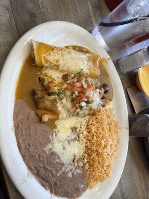 Combination platter with chicken enchilada and beef tamales