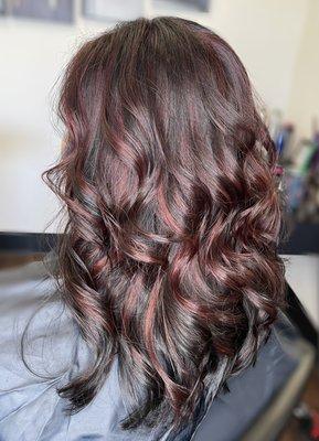 Partial red highlight on dark brown hair