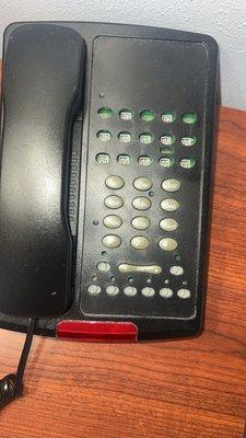 An old phone with missing buttons.