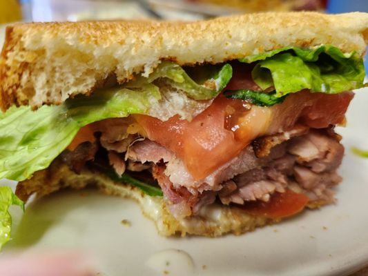 Baked ham, lettuce, tomato and bacon, on toasted Sour dough bread.The best most flavorful ham you will experience.