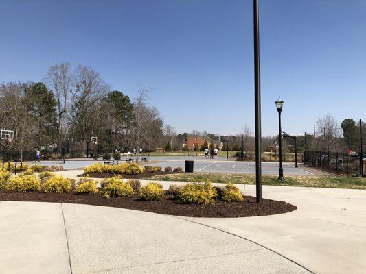 Full basketball court, two separate half basketball courts, pickle ball court and benches.