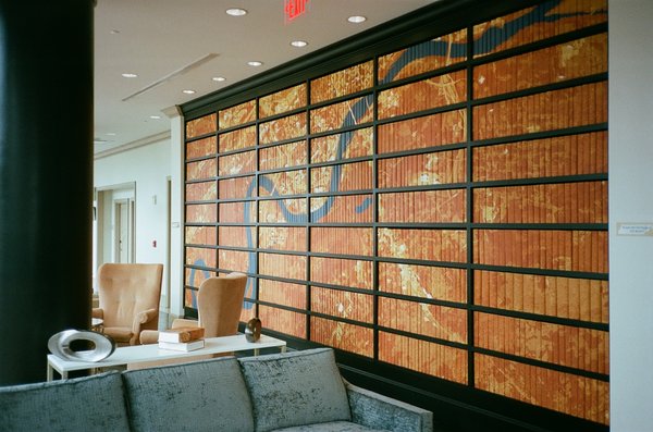 lobby sitting area with collaged map on books