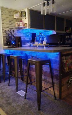 Custom wood bar, kitchen area with lighting