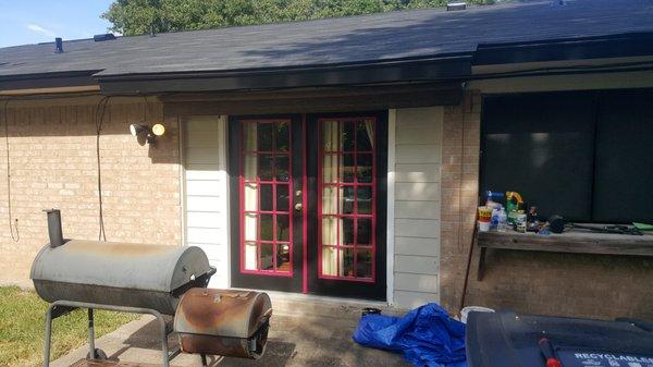 (After) Back of the house, new roof, vents and paint.