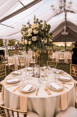 Centerpieces designed with a mixture of white dahlia, garden roses, scabiosa, stock, ranunculus, and spray roses!