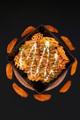 Our loaded "Downtown Fries" comes with grilled onions, grilled green peppers, nacho cheese, cool ranch Doritos, city sauce, and ranch!