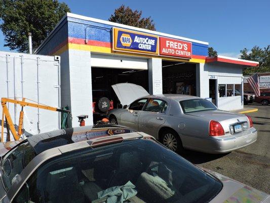 Closeup of the front of Fred's Auto Repair garage