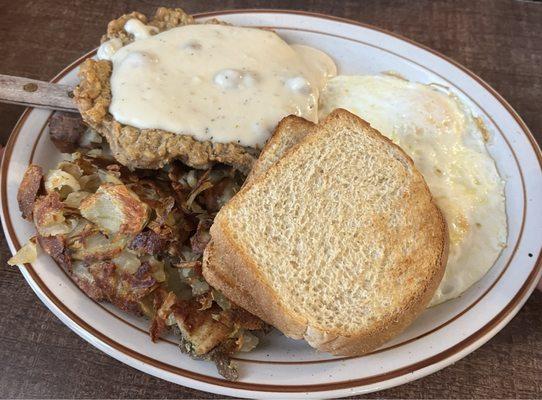 Country Fried Steak (with eggs, buttered toast, American fries, and sausage gravy)