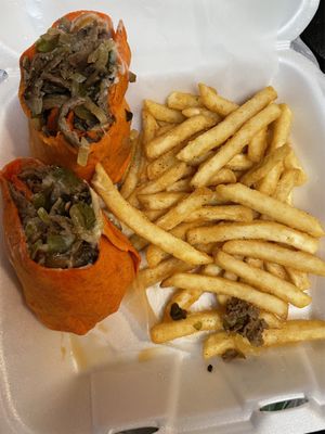 Philly cheesesteak wrap on tomato basil with fried