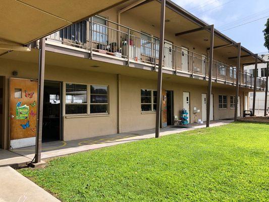 Community-style courtyard with plenty of grass to play on.