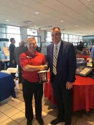 2017 Top Salesman Award for Scott Sandvoss with owner Tony Godfrey