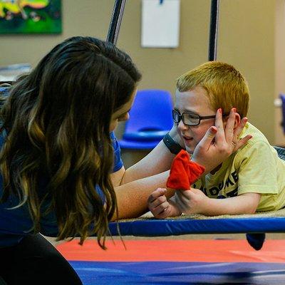 Boy with autism getting therapy at Twin Day at Hopebridge Autism Therapy Center