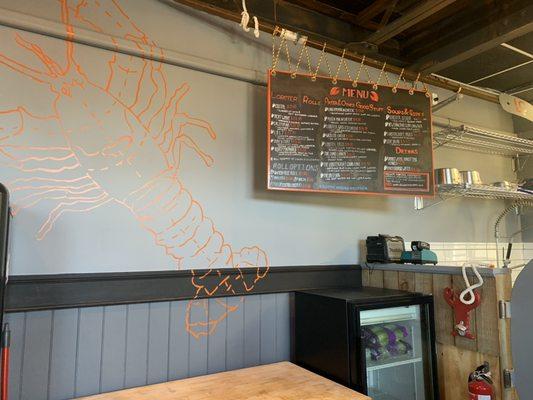 Our signature hand painted lobster and menu board