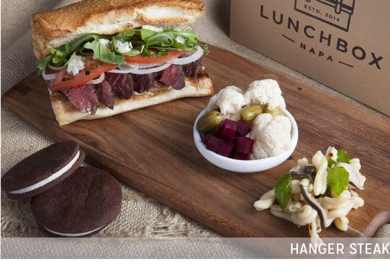 Hanger Steak Sandwich with house-made pickles, salad and sandwich cookie