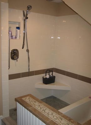 The owners wanted a large shower area, a tub, and laundry area in the space of the existing bathroom...