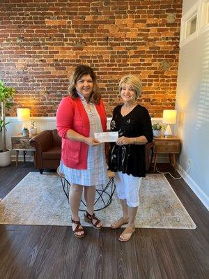 Donation from Guild-Cullman to Bosom Buddies.