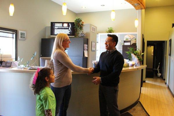 Dr. Andres greeting patients.