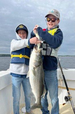 BROTHER DUO OF JACK AND CONNORS BROUGHT THIS STRIPER IN......