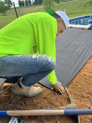 Putting down weed barrier