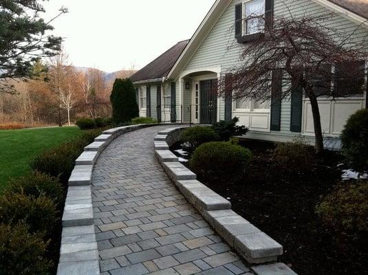 Accessible Front Entry Ramp constructed from stone creates a Flush Transition into Home