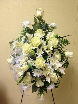 Sympathy Spray with white roses, lilies, and chrysanthemums