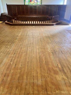 Before. Old church floor, covered with carpet adhesive and gunk