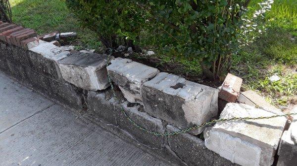 Brick wall siding around yard and brushes