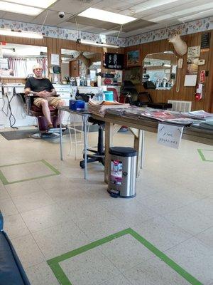 My husband waiting to get his haircut...