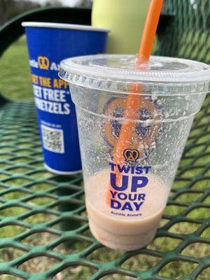 Cinnamon, sugar, pretzel in a cup and a strawberry smoothie