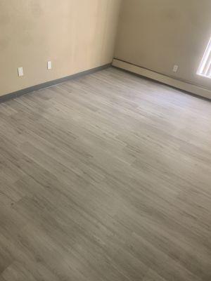 Vinyl plank flooring with cove base installed