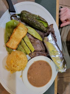 Skirt steak with grilled cactus, rice, beans and a very spicy and delicious grilled pepper