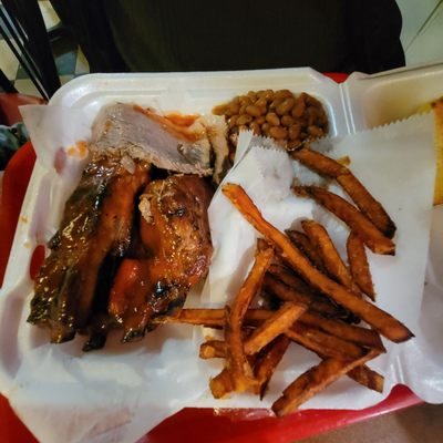 Brisket, bbq ribs, sweet potato fries and baked beans.