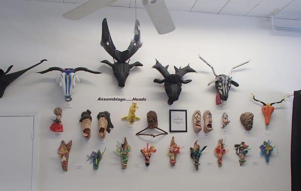 "Assemblage....Heads" art display