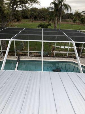 Partially re screened pool enclosure.