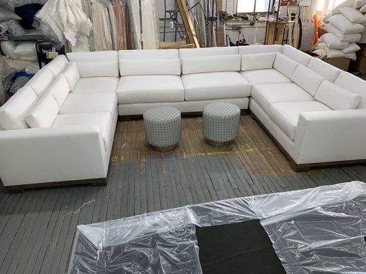 Build to Order and upholstery sectional.
Ottomans with a solid chrome base.