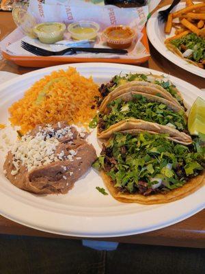 The Taco Pros Taco dinner with rice and beans.