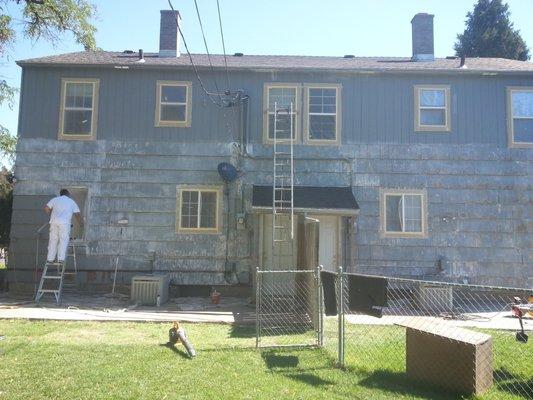 Classic A house duplex sealed with XIM bonding primer, locking down years of chipping peeling paint. Ready for latex topcoat.