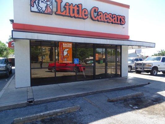 Little Caesars pizza storefront  tinted