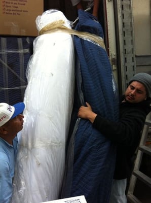 Folded/broken mattress. NOT safe load "background-checked employees".