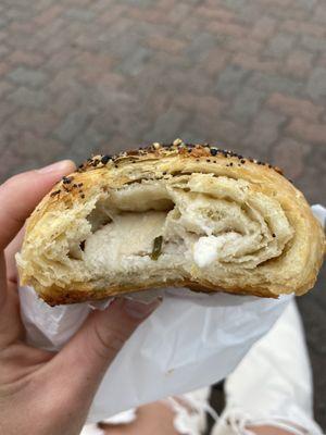 Snapshot of middle of the everything croissant with chive cream cheese in middle