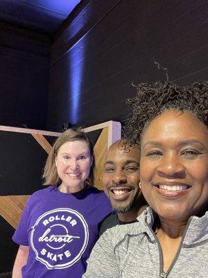 Me showing off my purple T-shirt. My instructor, (also the owner) Keith in the middle, and my classmate Sandra.